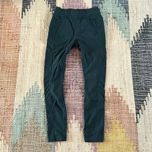 Deep emerald green skinny leg pull on style Prana hike pants with great pockets